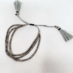 SILVER BEADED MULTI STRAND ADJUSTABLE BOHO BRACELET WITH TASSLES